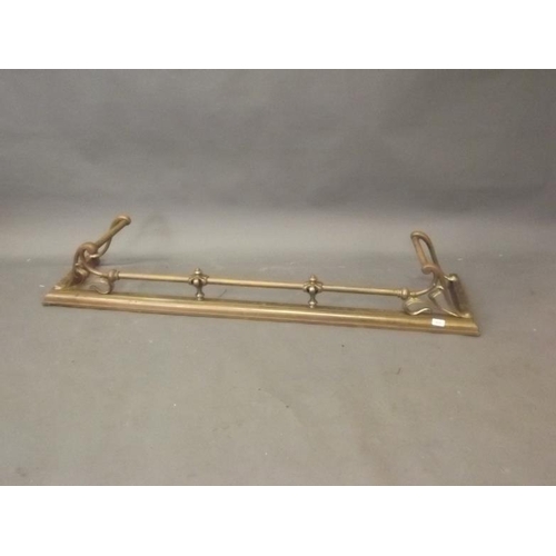 914 - A late C19th Art Nouveau brass fire fender to fit hearth, 54