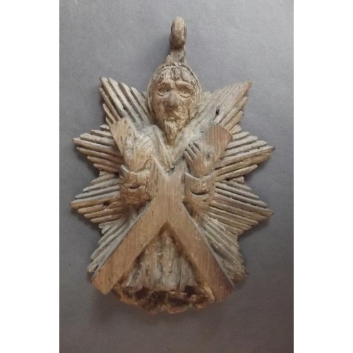 92 - A small antique carved wooden plaque depicting Saint Andrew, 6