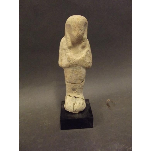 96 - An early Egyptian sandstone shabti, on a later base, 5½