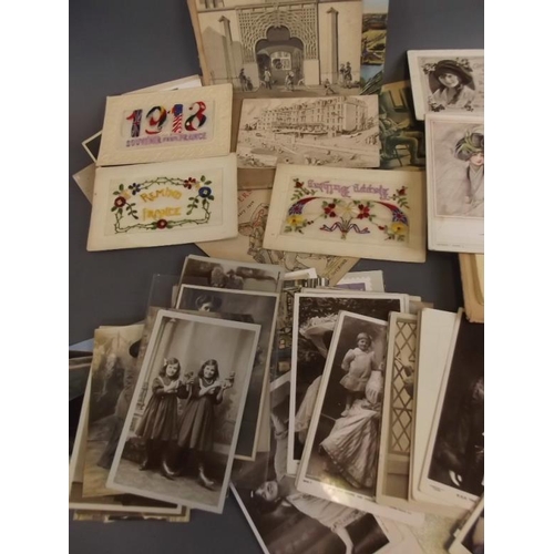 27 - Two albums of postcards, and a quantity of loose cards including WWI silks