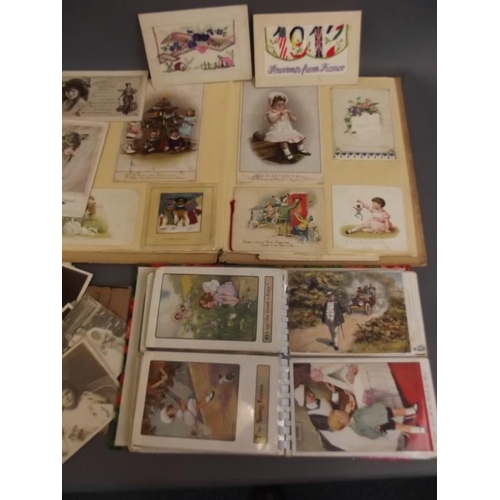 27 - Two albums of postcards, and a quantity of loose cards including WWI silks