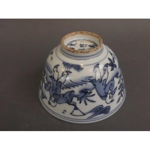 50 - A Chinese blue and white porcelain rice dish decorated with five boys playing in a garden, 6 charact... 