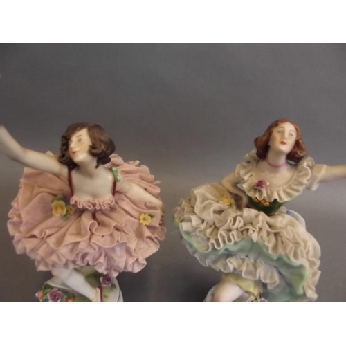 50G - A pair of German porcelain figures of ballerinas in lacework tutus with encrusted flower decoration,... 