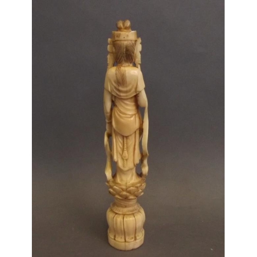 50J - A Chinese carved ivory figure of Quan Yin standing upon a lotus blossom, 7