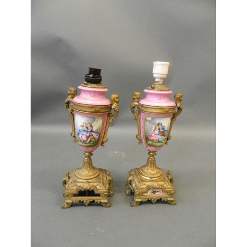 50N - A pair of pink ground Sevres style side urns with ormolu mounts and painted decoration of courting c... 