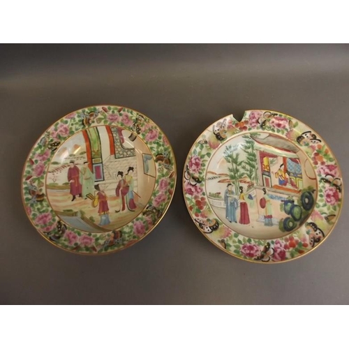 50P - A pair of Cantonese famille rose porcelain bowls decorated with figures in gardens, with rose and bu... 