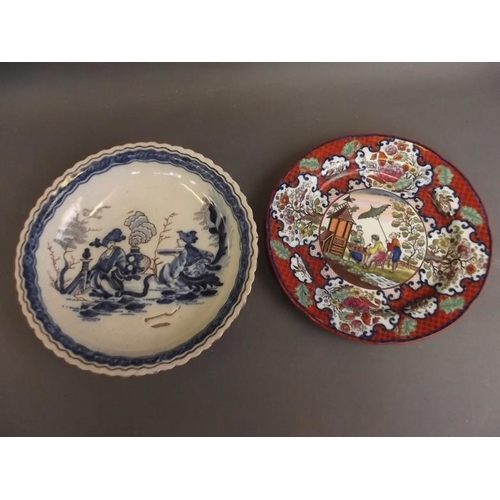 50S - A late C18th/early C19th Delft blue and white pottery dish decorated with figures in a garden, in th... 