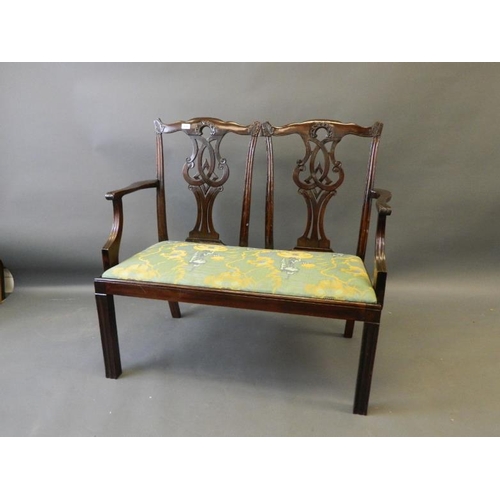 814 - A Chippendale style mahogany two seat settee with carved and pierced splats, 43