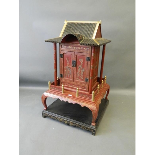 817 - A Chinese red lacquer shrine with gilt chinoiserie decoration, 26