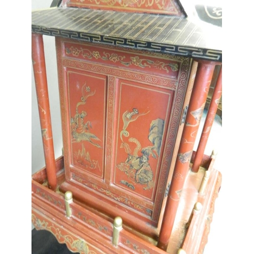 817 - A Chinese red lacquer shrine with gilt chinoiserie decoration, 26