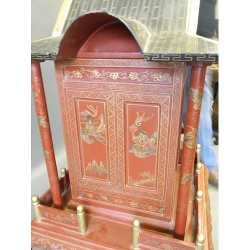 817 - A Chinese red lacquer shrine with gilt chinoiserie decoration, 26