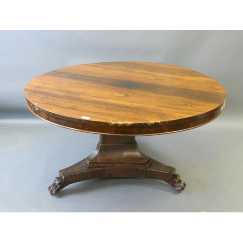 819 - A Victorian rosewood circular top breakfast table on a shaped column and triform platform base, rais... 