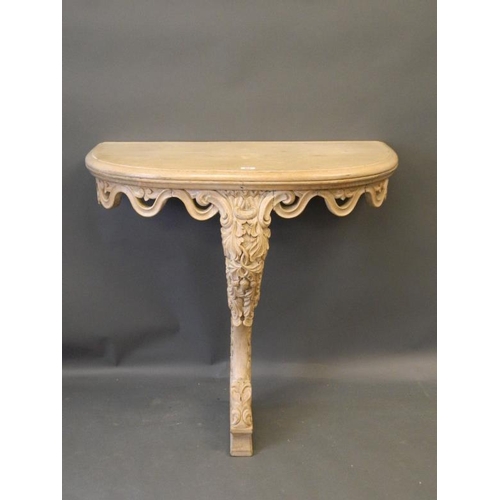 822 - A C19th lined oak D shaped console table with pierced frieze and acorn and oak leaf carved decoratio... 