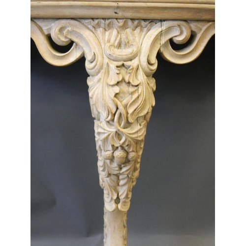 822 - A C19th lined oak D shaped console table with pierced frieze and acorn and oak leaf carved decoratio... 