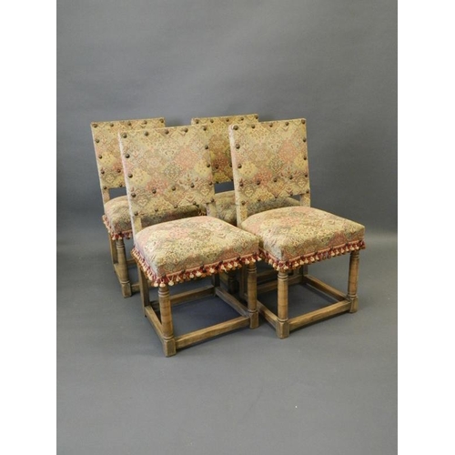 836 - A set of oak dining chairs with brass studded decoration and tasselled covers, Best Bid