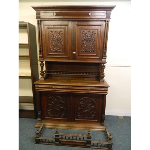 839 - A good two tier French oak dresser, the two cupboard upper section over open centre on two drawer an... 