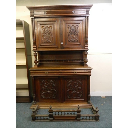 839 - A good two tier French oak dresser, the two cupboard upper section over open centre on two drawer an... 