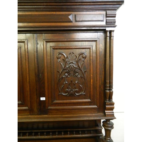 839 - A good two tier French oak dresser, the two cupboard upper section over open centre on two drawer an... 