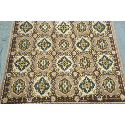 850 - A Chinese wool carpet with all over design on a coffee coloured ground, 79