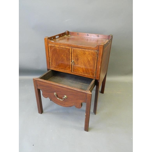 858 - A Georgian commode with pierced gallery top and two cupboards over a pull-out drawer, with all over ... 