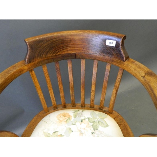 863 - A 1930s beechwood and ash bow desk chair, raised on turned supports with 'H' stretchers