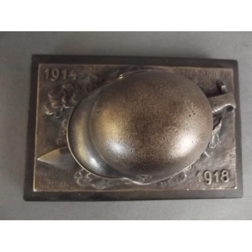 12 - A military style paperweight cast as a WWI German helmet and bayonet, 5