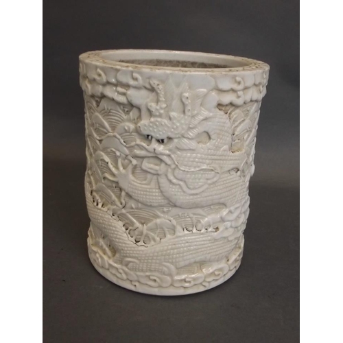 13 - A Chinese cream ground brush pot with relief twin dragon decoration, seal mark to base, 5