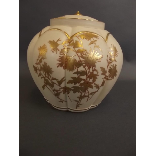 18 - A Royal Worcester bulbous ginger jar and cover of ribbed design, with ivory ground and gilt floral d... 