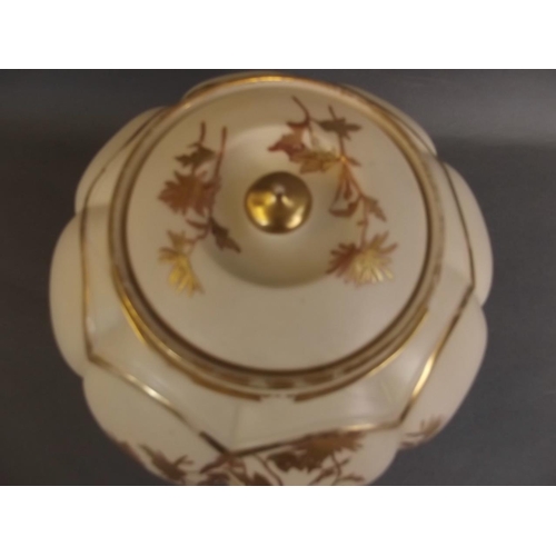 18 - A Royal Worcester bulbous ginger jar and cover of ribbed design, with ivory ground and gilt floral d... 