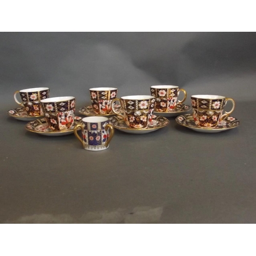 20 - A set of six Royal Crown Derby 'Imari' pattern coffee cups and six saucers, and a miniature tyg, unm... 