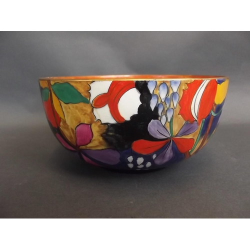 23 - An Art Deco Corona ware pottery bowl with hand painted decoration of stylised flowers in bright enam... 