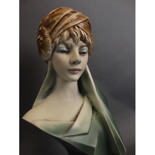 30 - An Art Deco style bust of a young lady wearing a stylised turban, 9