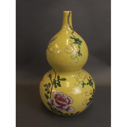 50 - A Chinese yellow ground double gourd porcelain vase with enamelled decoration of a bird perched on f... 