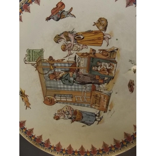 11 - A Sarreguemines porcelain plaque depicting an antique dealer at his stall, 12