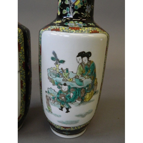 2 - A pair of Chinese famille noire porcelain vases with decorative panels of women and children in gard... 