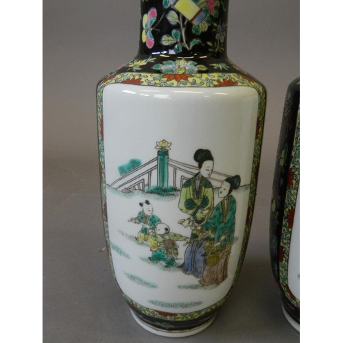 2 - A pair of Chinese famille noire porcelain vases with decorative panels of women and children in gard... 