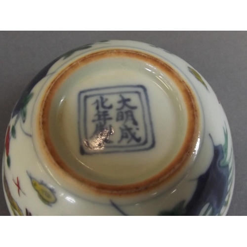 5 - A Chinese Doucai enamel porcelain tea bowl with painted chicken decoration, 6 character mark to base... 