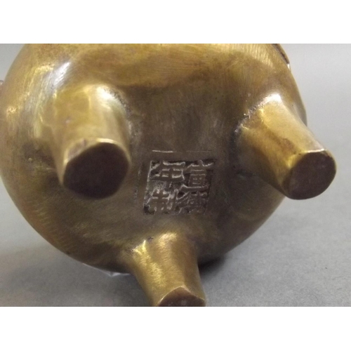 9 - A small Chinese bronze censer with twin kylin handles and bat decoration, on tripod feet, seal mark ... 