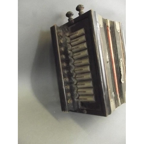 17 - A small vintage concertina with ten keys and three buttons, 9½