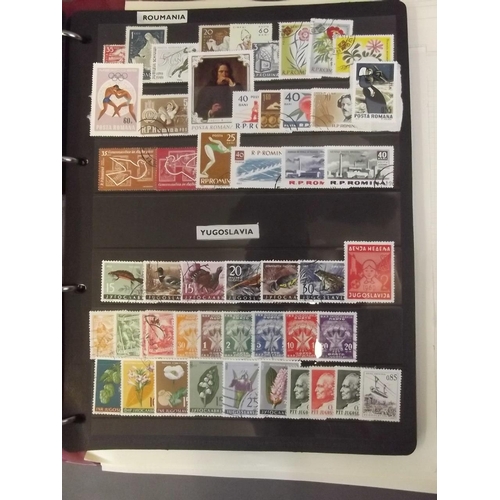 22 - An album of 'All World' postage stamps, mostly C20th, and several loose sheets of mounted stamps