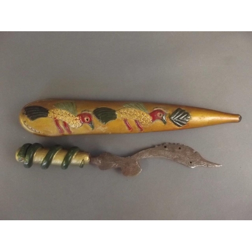 24 - An antique Indonesian kujang with carved and painted wood handle and sheath, the handle carved with ... 