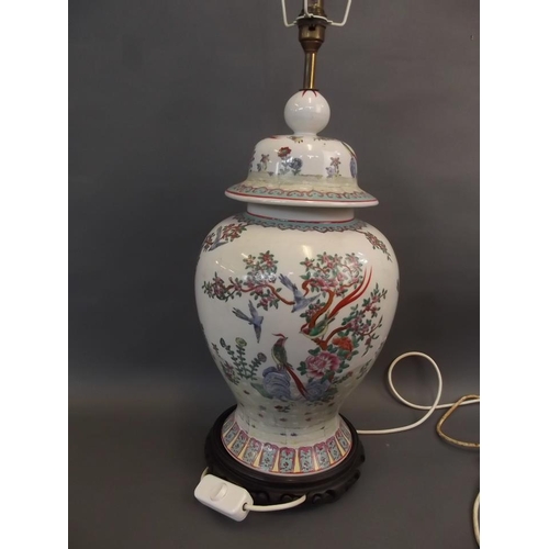 33 - A large Oriental porcelain baluster vase shaped lamp base, on a carved wood stand, 24