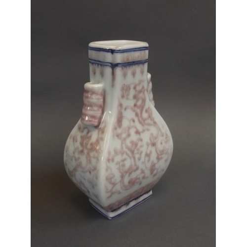 35 - A Chinese twin lug porcelain vase with scrolling dragon decoration, seal mark to base, 6