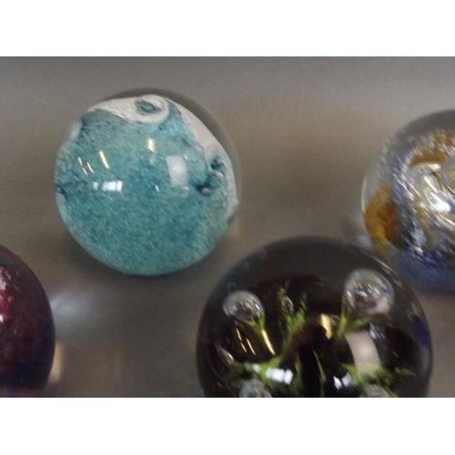 50E - A collection of six Caithness Art glass paperweights including the designs 'Titania', 'Tidal Wave', ... 