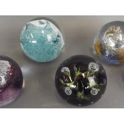 50E - A collection of six Caithness Art glass paperweights including the designs 'Titania', 'Tidal Wave', ... 