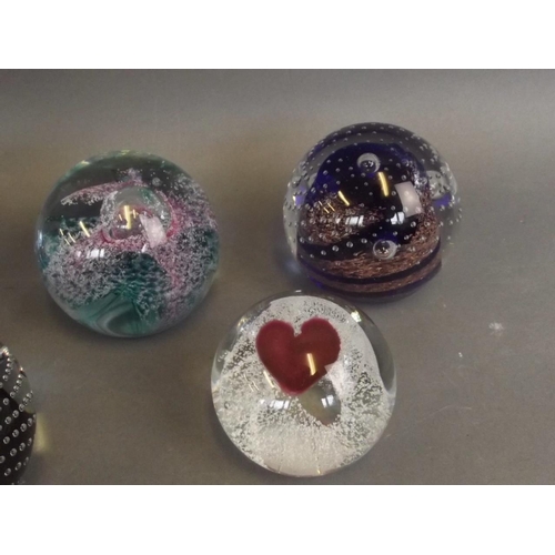 50F - A collection of six Caithness Art glass paperweights including designs 'Sweetheart', 'Goldrush', 'Bi... 