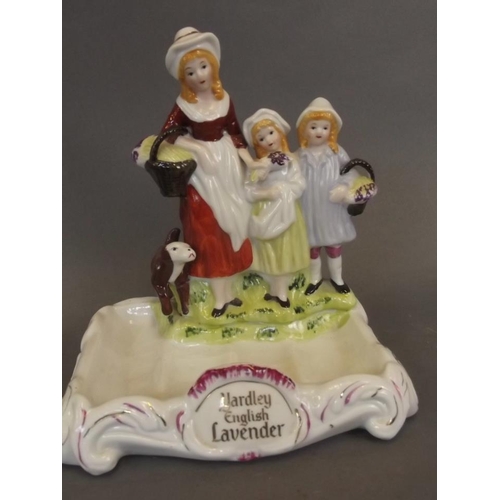 4 - A Staffordshire style ceramic soap dish moulded as a mother, two children and a dog, bears cartouche... 