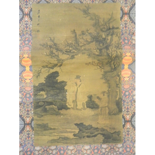 15 - A Chinese printed watercolour scroll of a sage in a garden, 23½