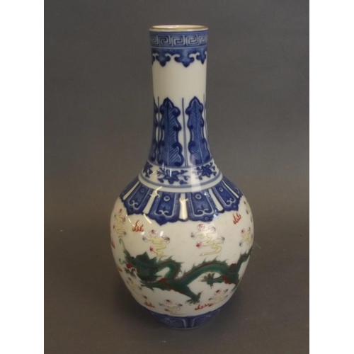 24 - A Chinese blue and white porcelain vase with painted green and puce enamel twin dragon decoration, s... 