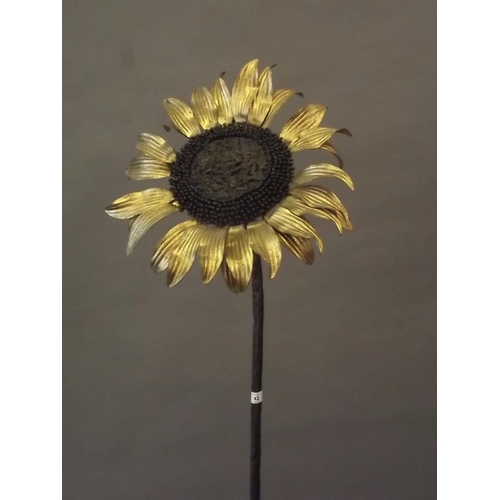 42 - A cast iron sculpture of a sunflower with gilt petals, 65